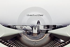 The word ghost writer typed on the paper with a vintage typewriter