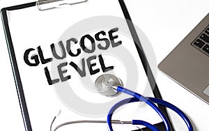 Word Glucose Level with pen on the paper sheet, Medical concept