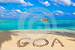 Word Goa on beach