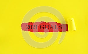 Word 2021 Goals on torn yellow paper background. new year 2021 resolution, setting up goals, targets to achieve concept
