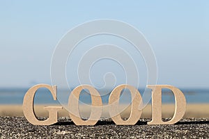 Word good made with wooden block