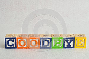 The word goodbye spelled with colorful alphabet blocks