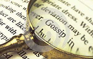 The word `gossip` emphasized by a magnifying glass.