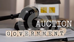 Word GOVERNMENT AUCTION composed of wooden dices