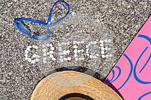 The word Greece made of shells on beach in the sand.