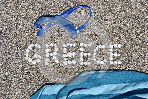 The word Greece made of shells on beach in the sand.