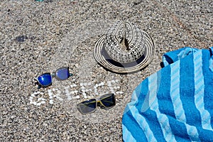 The word Greece made of shells on beach in the sand.