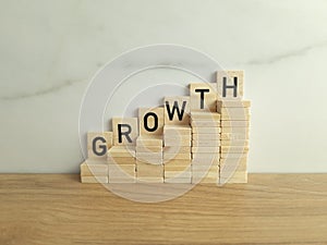 Word growth made from wooden blocks