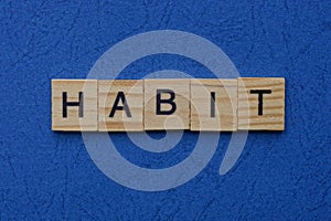 Word habit made from brown wooden letters photo