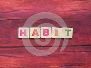 Word Habit on wood