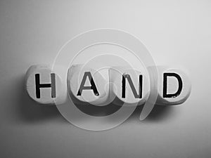 Word hand spelled on dice