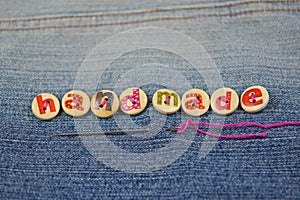 The word handmade spelled in lettered buttons photo