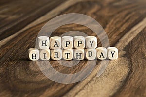 Word HAPPY BIRTHDAY on wooden cubes