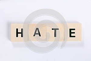 Word hate made of wooden blocks isolated on white background