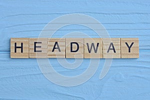 word headway made from wooden gray letters