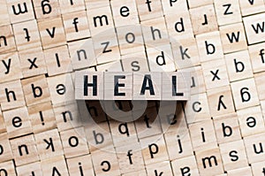 The word of HEAL on wooden cubes