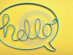 The word `HELLO` is made of blue wire.