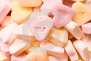 Word Help engraved in a sweet heart-shaped candy  couples therapy concept