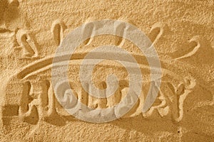 Word Holiday. Summer in the sand. Sun symbol sign