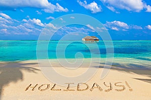 Word Holidays on beach