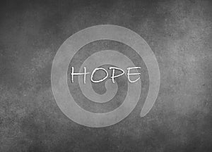 The word hope on a gray background . The concept of faith and hope