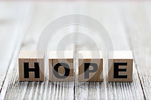 The word hope made of wooden cubes