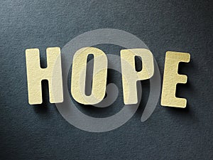 The word Hope on paper background