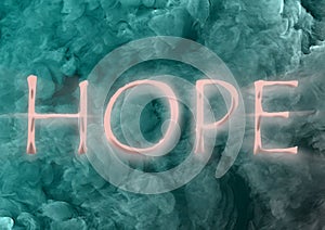 the word hope on a smoky background. The concept of faith and hope