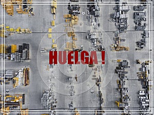 Word Huelga in spanish language. Industrial storage place, view photo