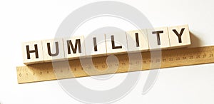 Word HUMILITY made with wood building blocks