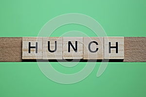 word hunch made of small gray wooden letters photo