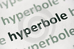 Word hyperbole printed on paper macro