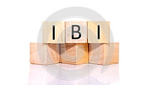 Word IBI composed of wooden letters. wooden blocks photo