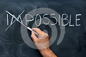 Impossible handwritten on blackboard