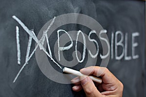 Impossible handwritten on blackboard