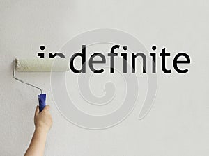 The word indefinite is filled with white paint and becomes definite