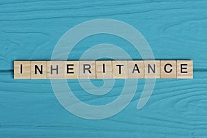 word inheritance made from wooden gray letters