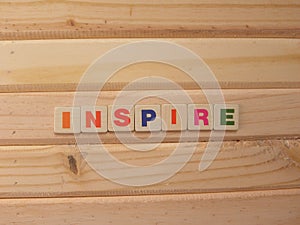 Word Inspire on wood