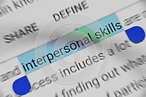 Word `Interpersonal Skills` selected and highlighted digitally on mobile display screen