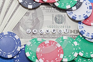 Word `JACKPOT` with poker chips and money