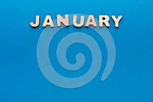 Word January on blue background