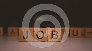 Word `job` of the wooden cubes. Job search concept