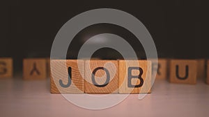 Word `job` of the wooden cubes. Job search concept