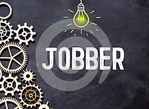 word Jobber on black background, concept business