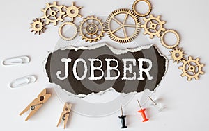 word JOBBER on wooden block, business concept