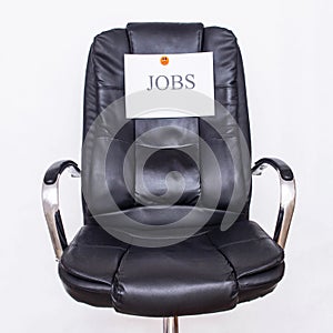 The word jobs on an office business chair. The concept of the workflow in the office, recruitment and vacancies