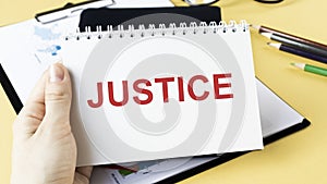 The word Judgment is written on a notebook.