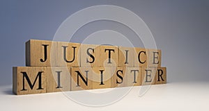 The word justice minister was created from wooden cubes. State and law.