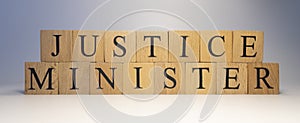 The word justice minister was created from wooden cubes. State and law.