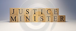 The word justice minister was created from wooden cubes. State and law.